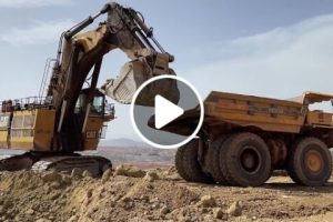 Huge 450 Tons Caterpillar 6040 Hydraulic Excavator Loading Hitachi & Terex Dumpers